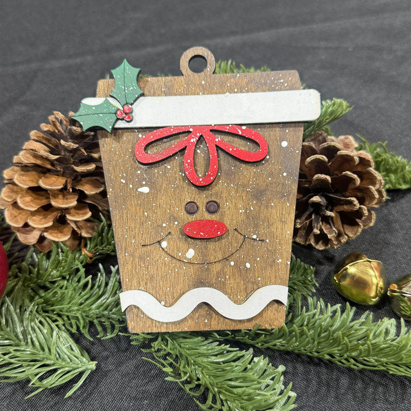 Wooden ornament shaped like a gingerbread man with pine cones and greenery on a dark background