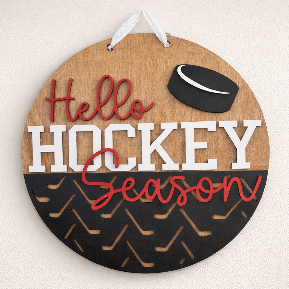 Round wooden sign with 'Hello Hockey Season' text and hockey puck design on a white background