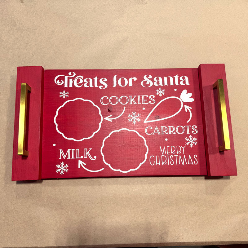 Red tray with white text and graphics for Santa on a beige background