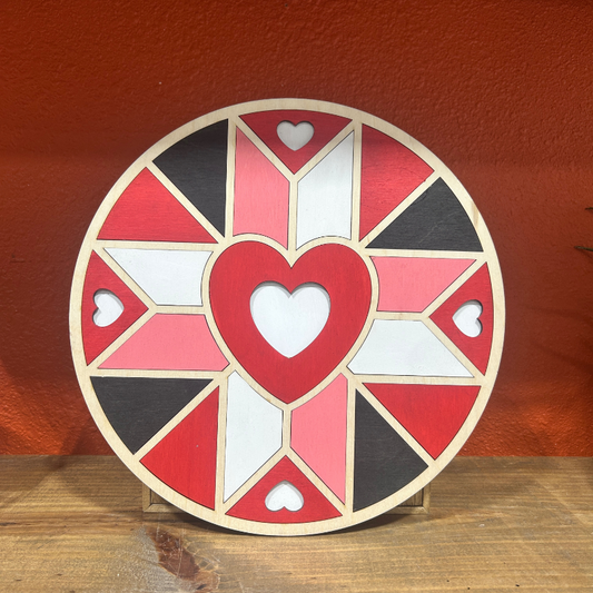 Decorative plate with heart design on a wooden surface